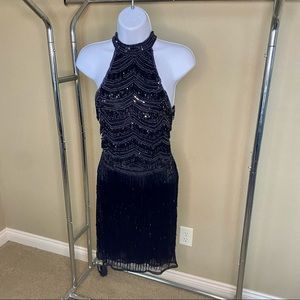 This Sherri Hill is heavy!! It is all stoning and beaded fringe. Size 2